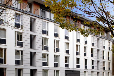 View of the exterior façade of a white residential building